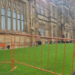 Fortress orange crowd barriers on lawn
